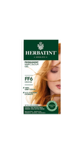 Herbatint hair color gel packaging with a model featuring orange hair.